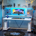 Load image into Gallery viewer, White LED gaming desk with blue LED lighting, a monitor and desktop speakers