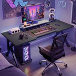 Load image into Gallery viewer, Gaming desk 100cm with a monitor riser, keyboard and gaming chair in a home office
