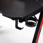 Load image into Gallery viewer, Z-shaped gaming desk detail, the headphone hook and cup holder mounted under the carbon fibre look desktop edge

